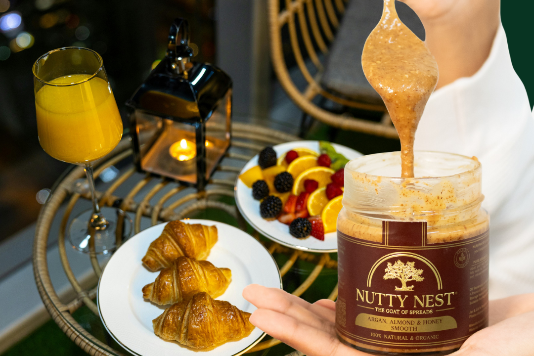 Nutty Nest premium almond butter with argan oil and honey breakfast spread with fruit and croissants