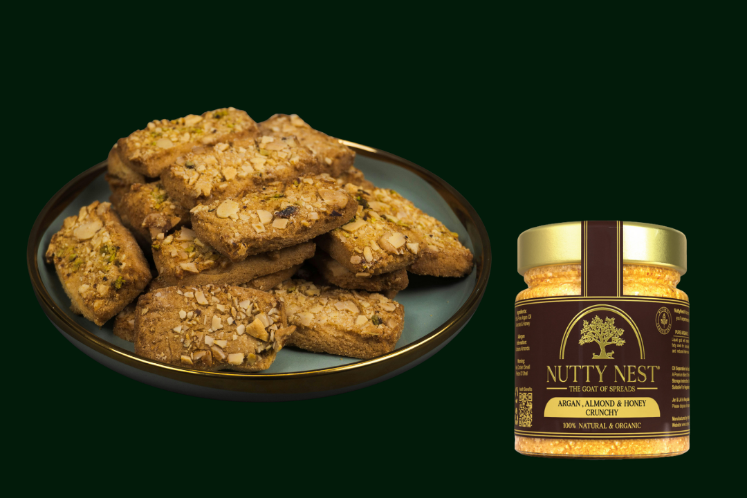 NuttyNest crunchy almond butter with argan oil and honey shown in a jar alongside a freshly baked bakery item, highlighting natural ingredients and a premium breakfast use.