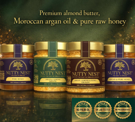 Luxury hero banner featuring the NuttyNest collection of almond butter jars made with argan oil and raw English honey, styled with natural almonds, golden honey, and Moroccan argan oil on a light stone background, conveying premium quality, purity, and clean nutrition